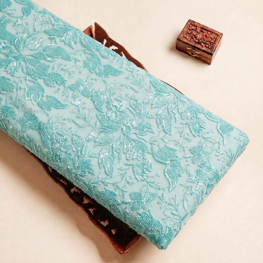 Folded Green Embroidery Net Fabric Highlighting Sequin Floral and Texture