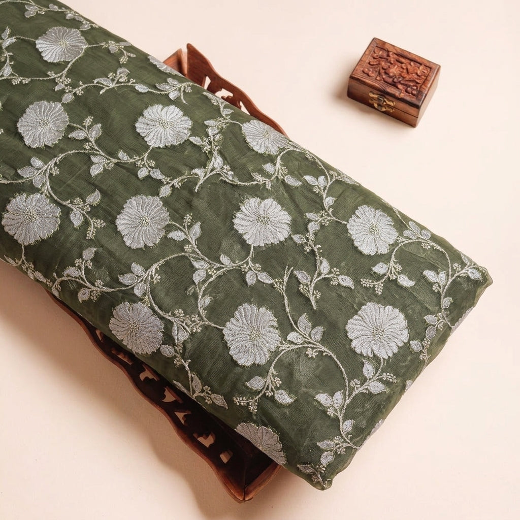 Embroidery Green Embroidery Semi Banaras Fabric on a wooden tray