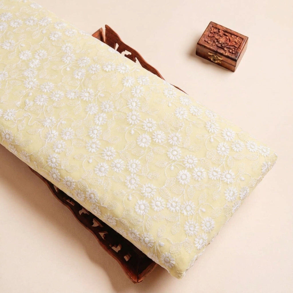 Folded Yellow Embroidery Cotton Fabric Highlighting Thread Work Floral and Texture