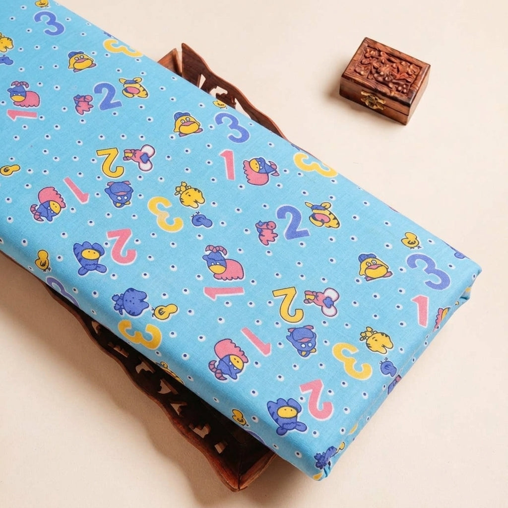 Folded Blue Printed Cotton Fabric Highlighting Kids and Texture