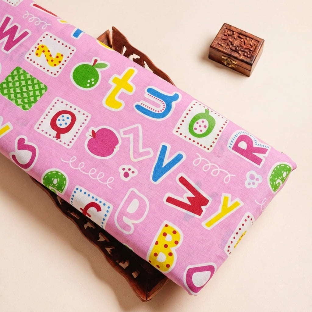 Folded Pink Printed Cotton Fabric Highlighting Kids and Texture