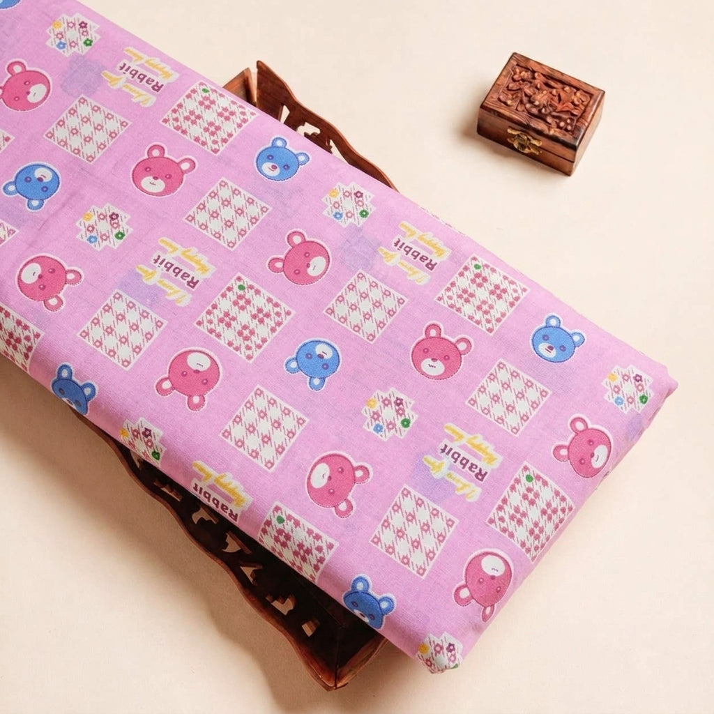 Folded Pink Printed Cotton Fabric Highlighting Kids and Texture