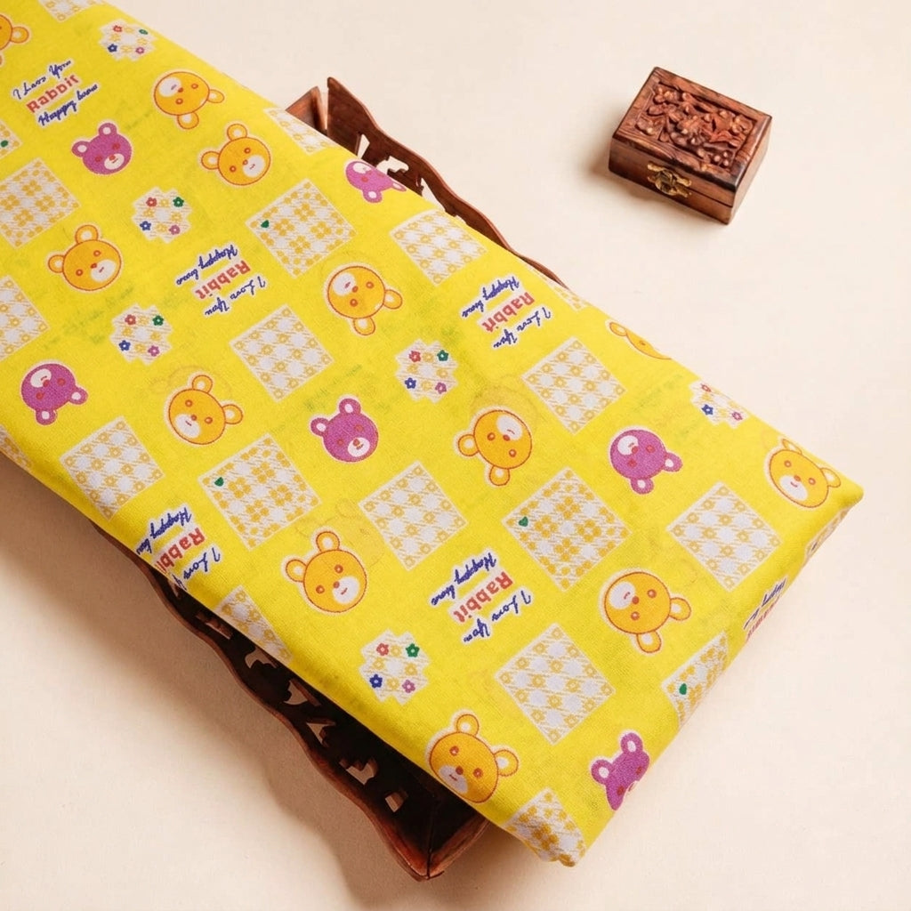 Folded Yellow Printed Cotton Fabric Highlighting Kids and Texture