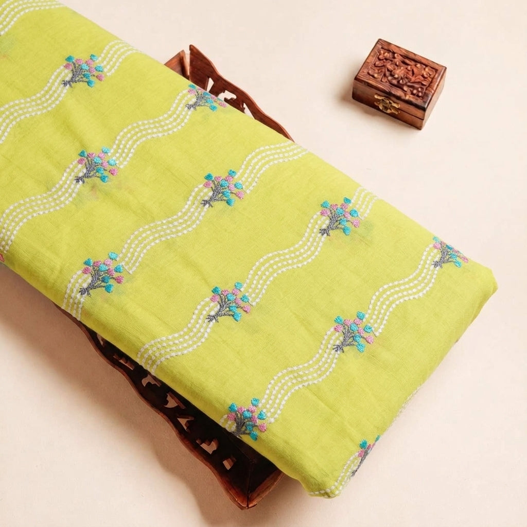 Folded Yellow Embroidery Cotton Fabric Highlighting Thread Work Floral and Texture