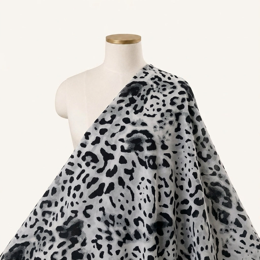 Animal Print White Animal Print Lycra Fabric Draped as a saree