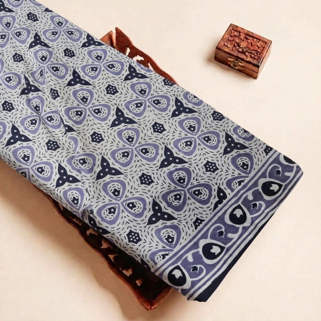 Folded Purple Floral Cotton Fabric Highlighting Border and Texture
