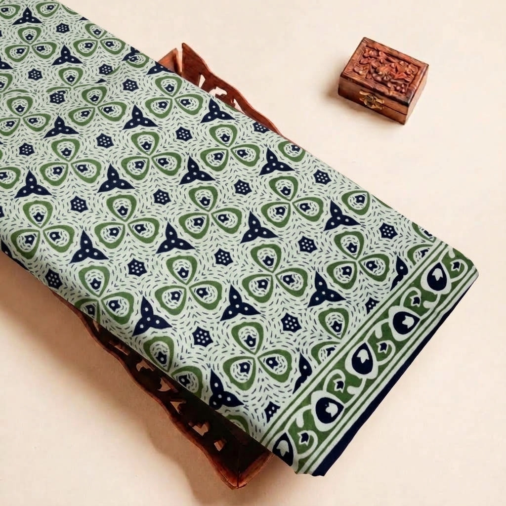 Folded Green Floral Cotton Fabric Highlighting Border and Texture