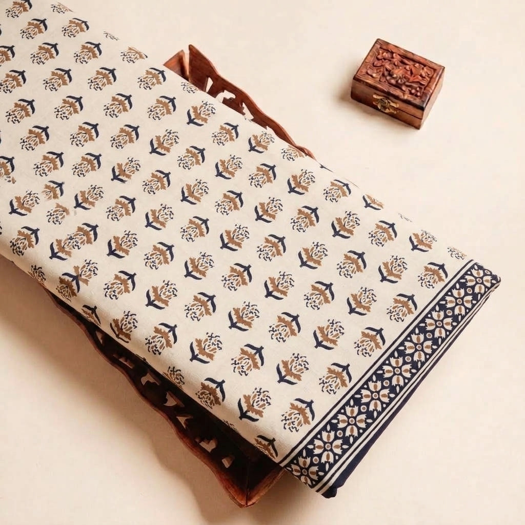 Folded Beige Floral Cotton Fabric Highlighting Border and Texture