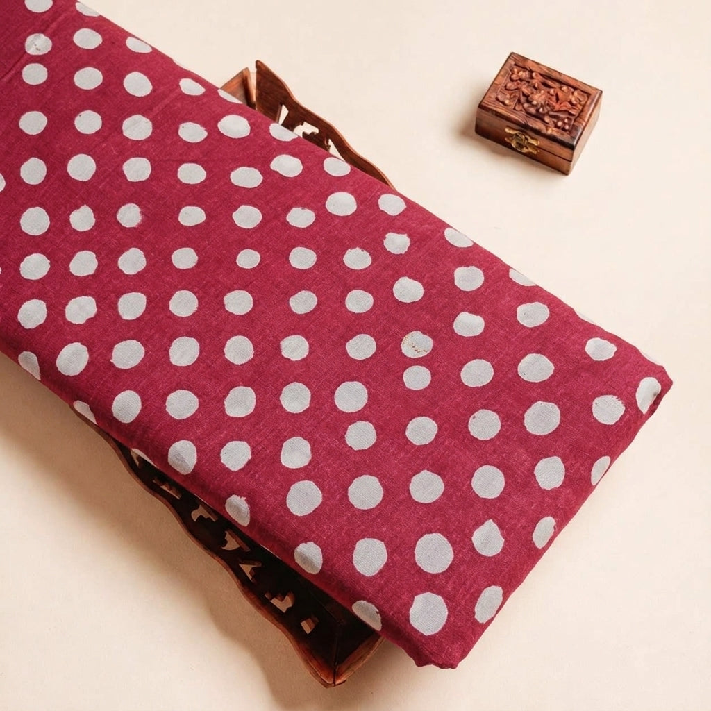 Folded Maroon Polka Dots Cotton Fabric Highlighting Polka Dots and Texture