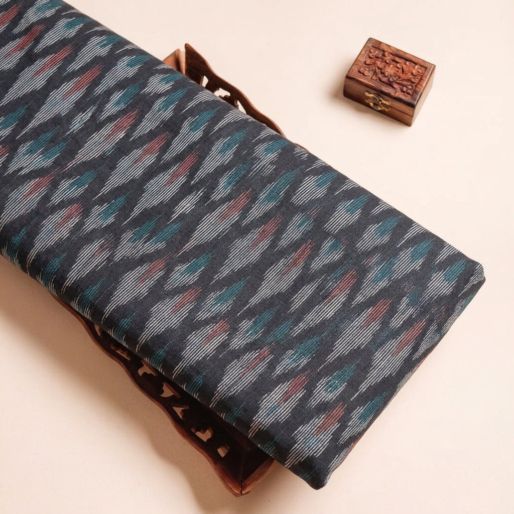 Ikat Black Ikat Cotton Fabric on a wooden tray