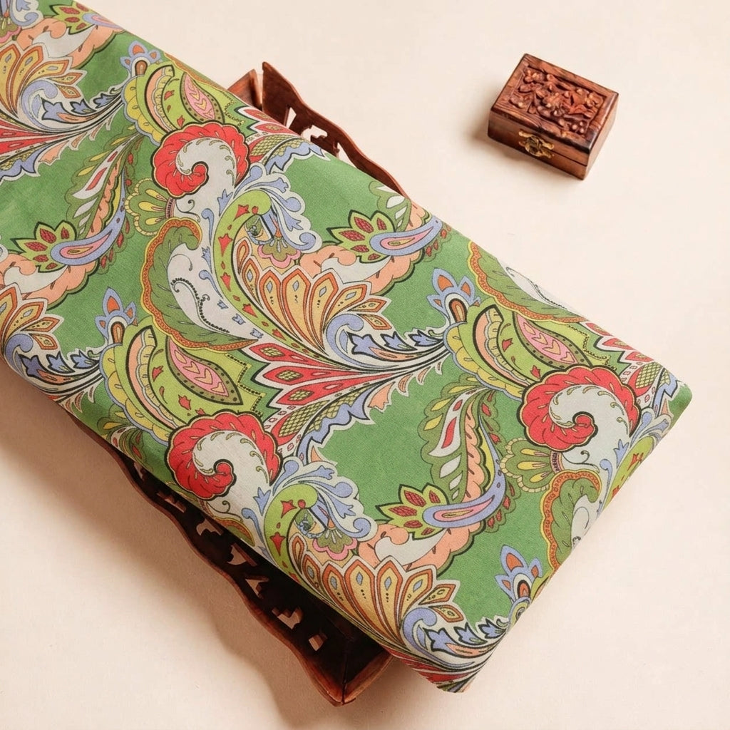 Folded Green Paisley Satin Fabric Highlighting and Texture