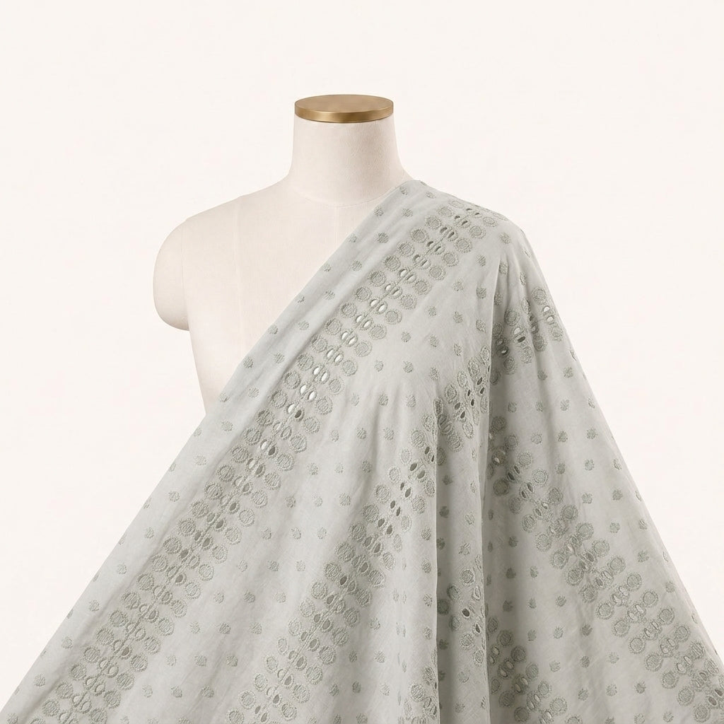 Cutwork Pastel Green Cutwork Cotton Fabric Draped as a saree