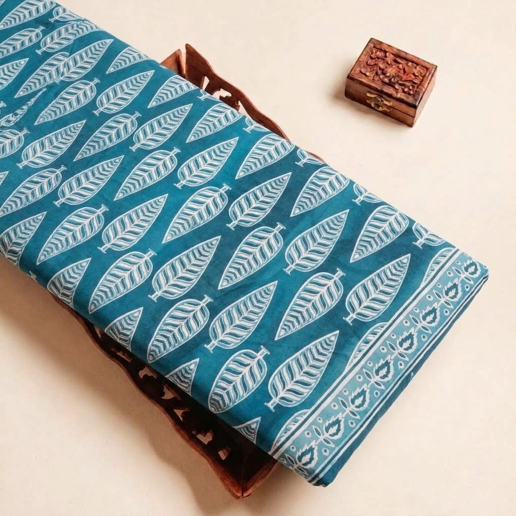 Folded Light Blue Leaf Cotton Fabric Highlighting Border and Texture