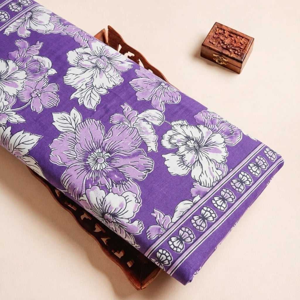 Folded Purple Floral Cotton Fabric Highlighting Border and Texture