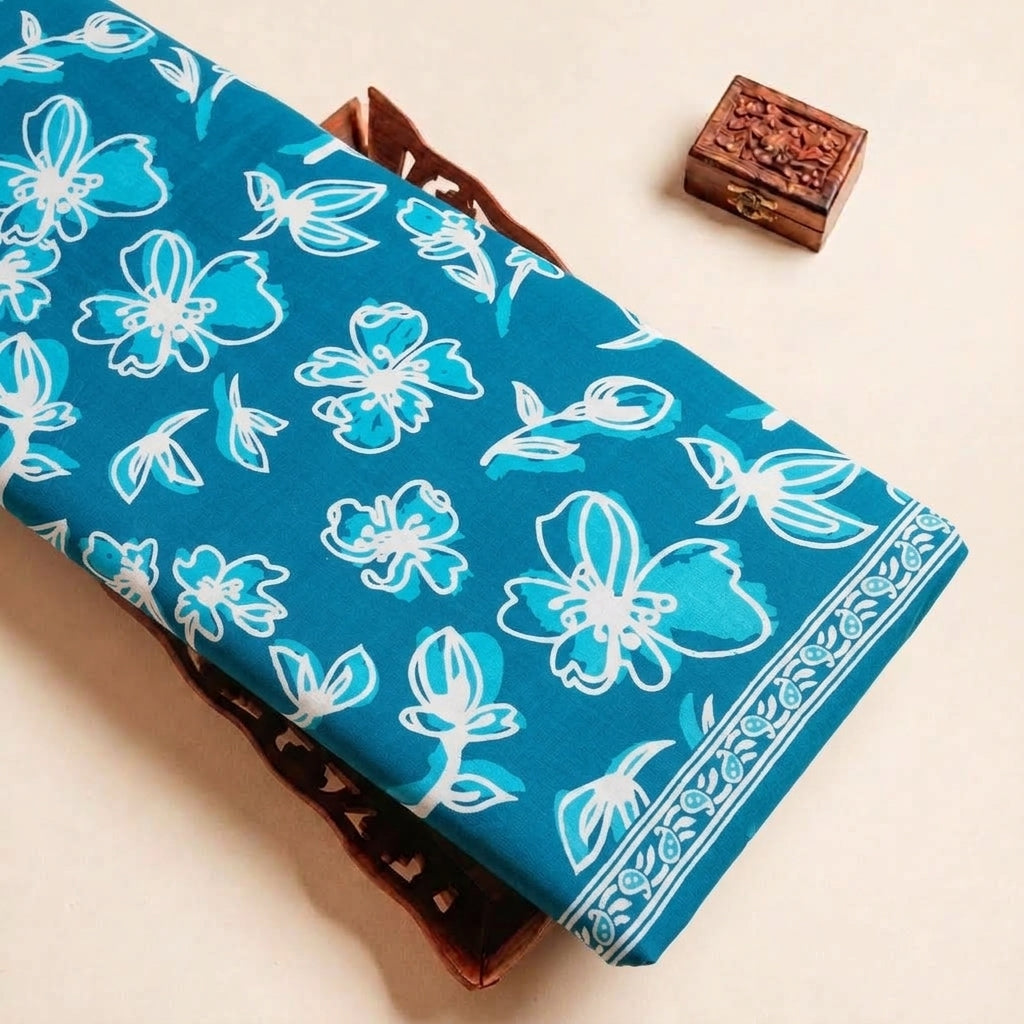 Folded Blue Floral Cotton Fabric Highlighting Border and Texture