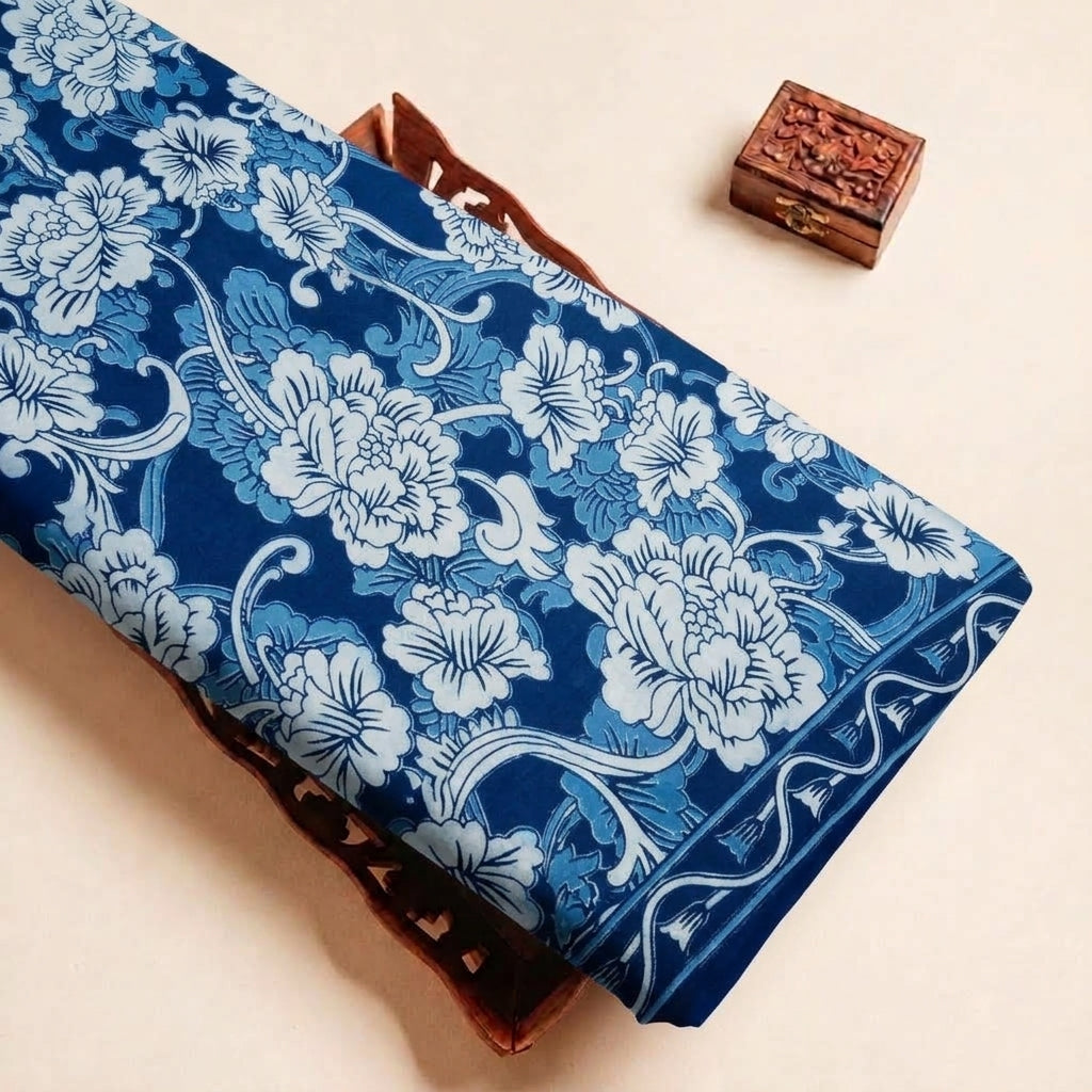 Folded Blue Floral Cotton Fabric Highlighting Border and Texture