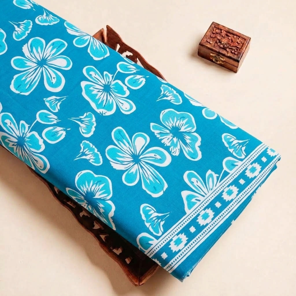 Folded Blue Floral Cotton Fabric Highlighting Border and Texture