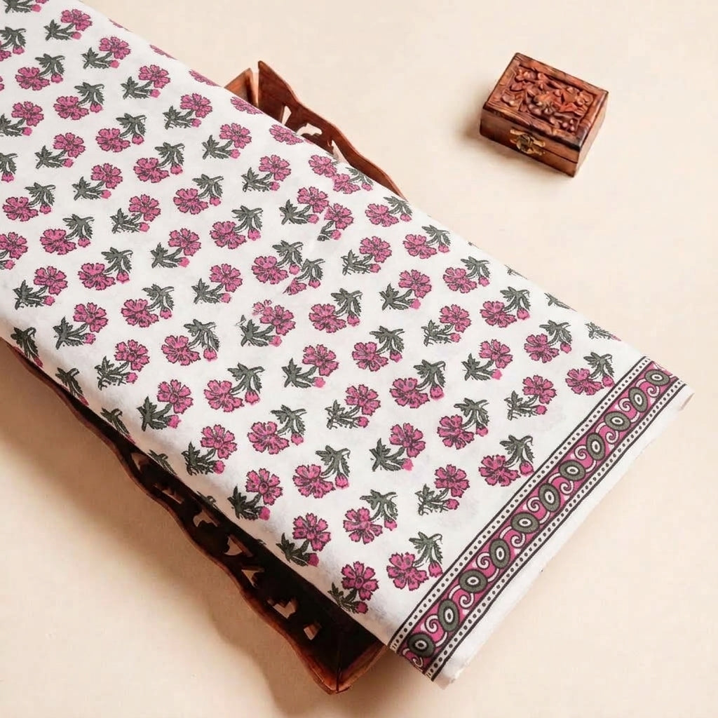 Folded White Floral Cotton Fabric Highlighting Border and Texture