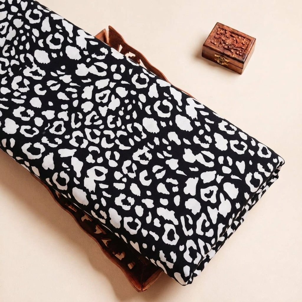 Folded Black Animal Print Crepe Fabric Highlighting and Texture