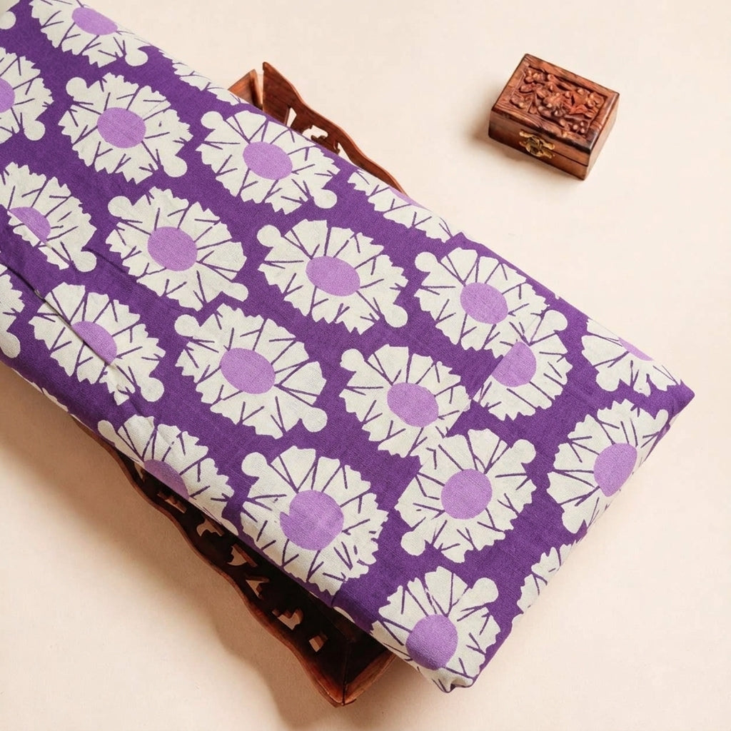 Folded Purple Floral Cotton Fabric Highlighting Border and Texture