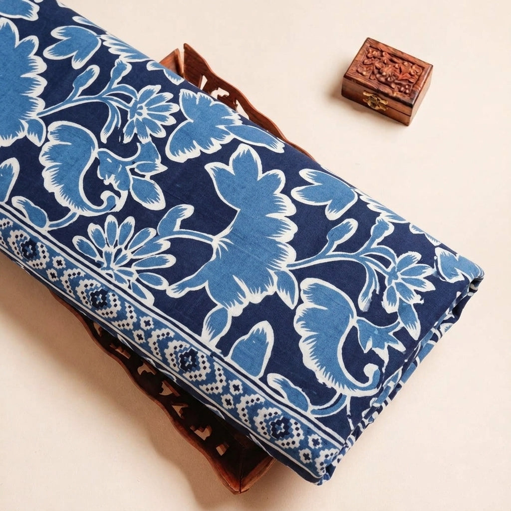 Folded Blue Floral Cotton Fabric Highlighting Border and Texture
