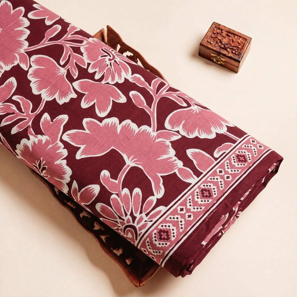 Folded Maroon Floral Cotton Fabric Highlighting Border and Texture