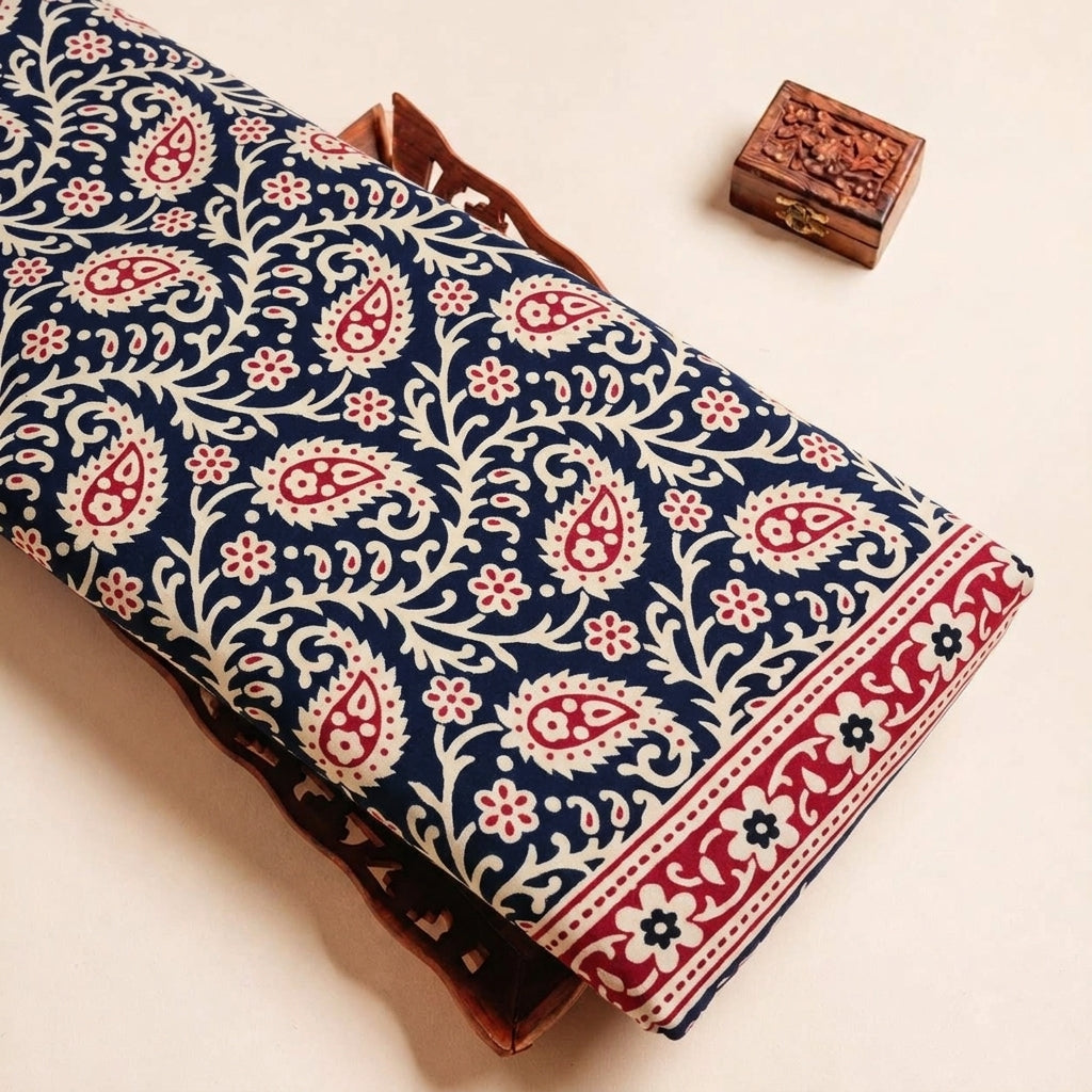 Folded Black Paisley Cotton Fabric Highlighting Border and Texture