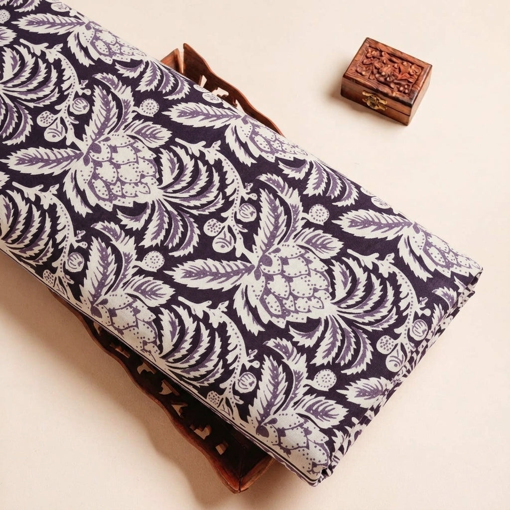 Folded Purple Floral Cotton Fabric Highlighting Border and Texture
