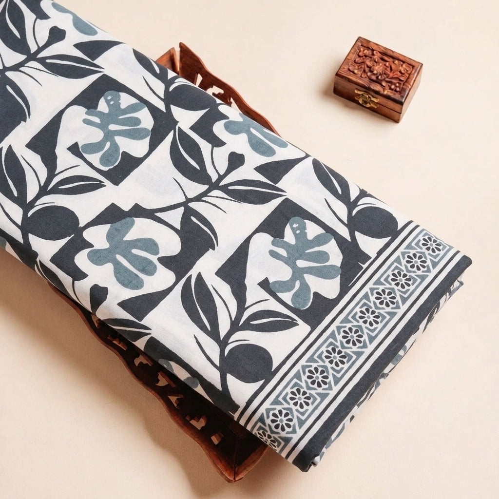 Folded Green Floral Cotton Fabric Highlighting Border and Texture
