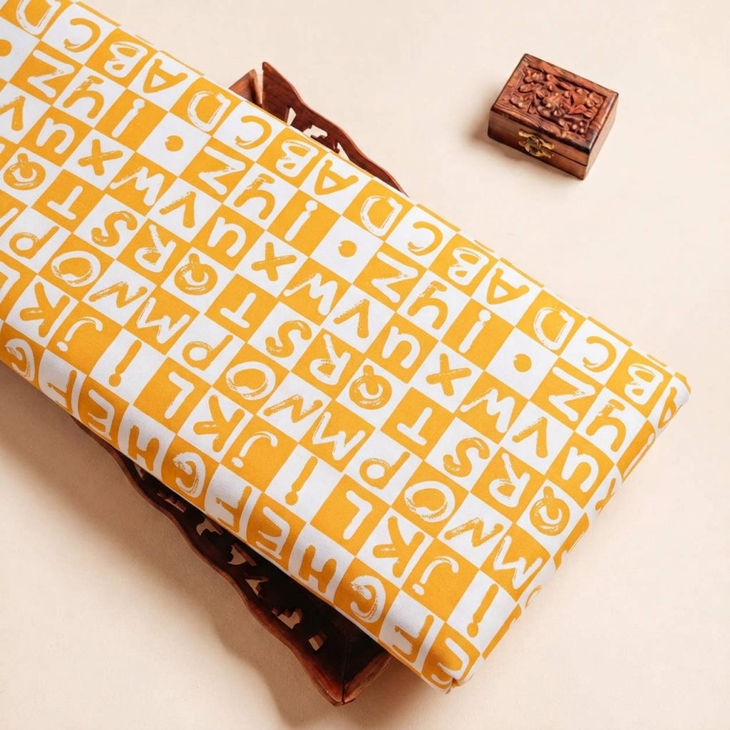 Folded Yellow Printed Satin Fabric Highlighting and Texture