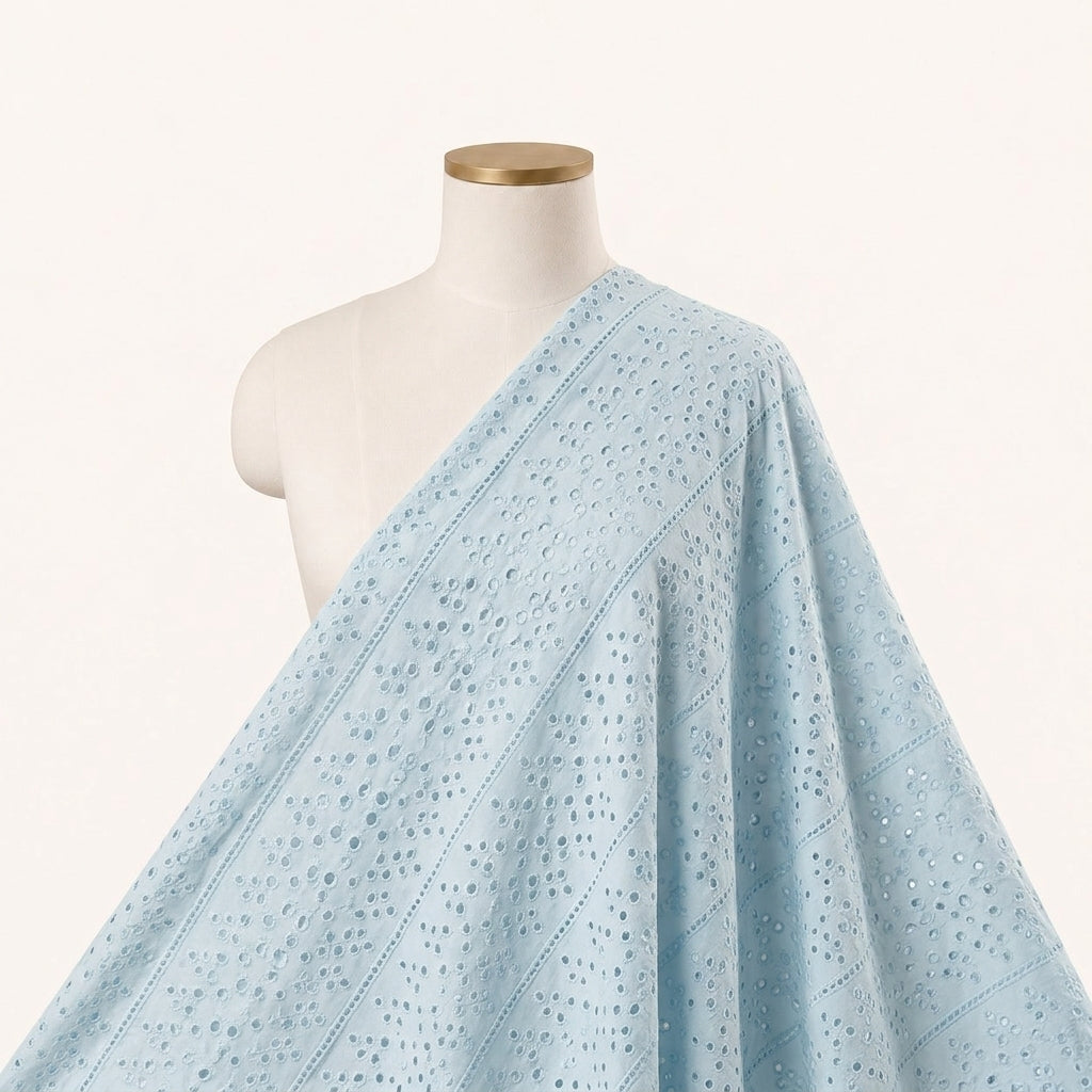 Cutwork Blue Cutwork Cotton Fabric Draped as a saree