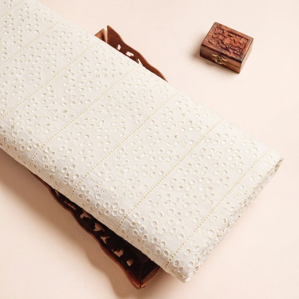 Cutwork Yellow Cutwork Cotton Fabric on a wooden tray