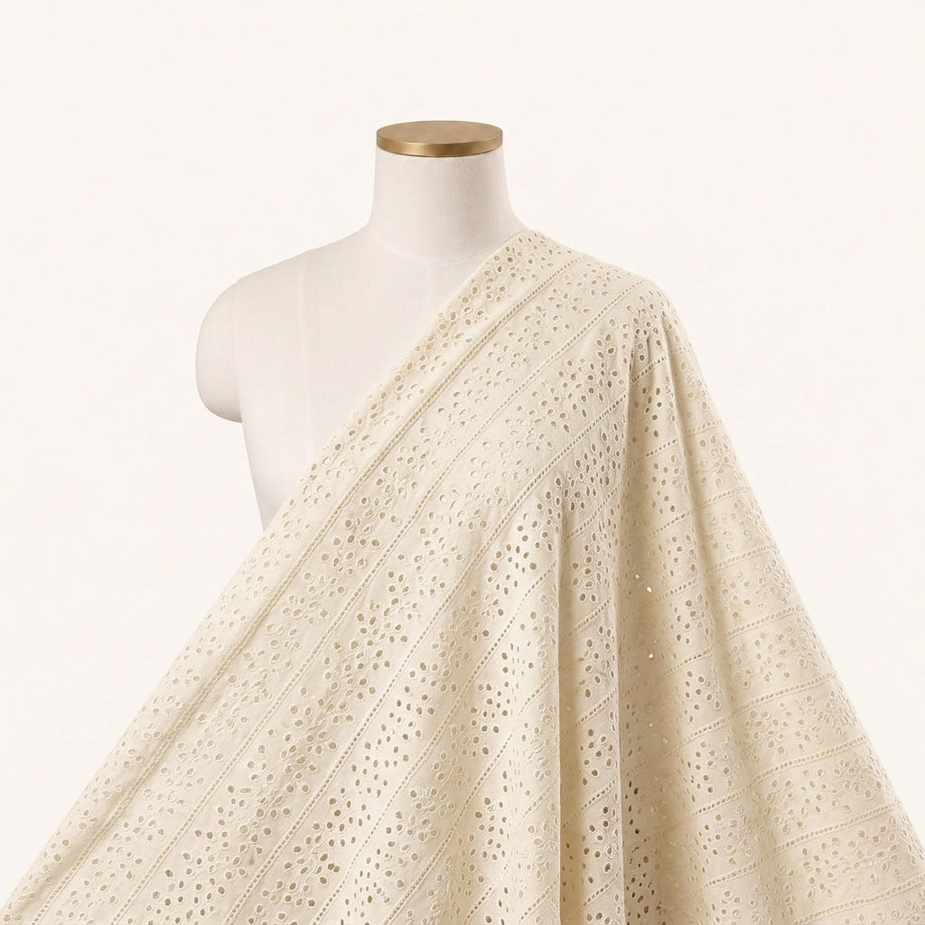 Cutwork Yellow Cutwork Cotton Fabric Draped as a saree