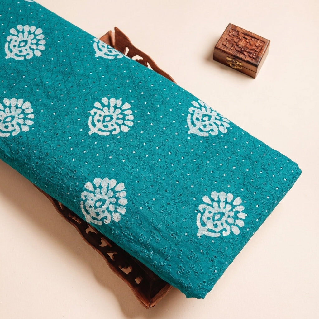 Batik Hakoba Sea Green Batik Hakoba Cotton Fabric on a wooden tray