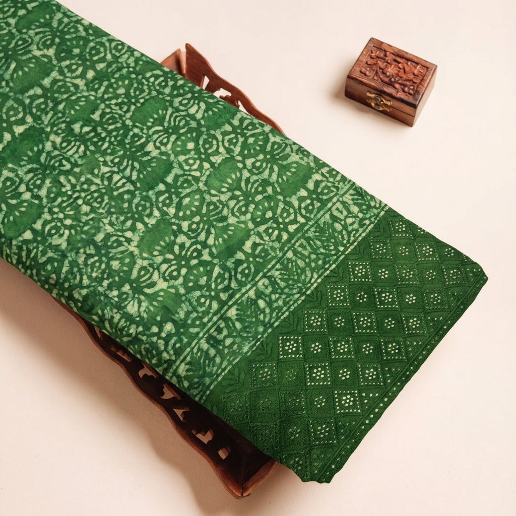 Batik Hakoba Green Batik Hakoba Cotton Fabric on a wooden tray