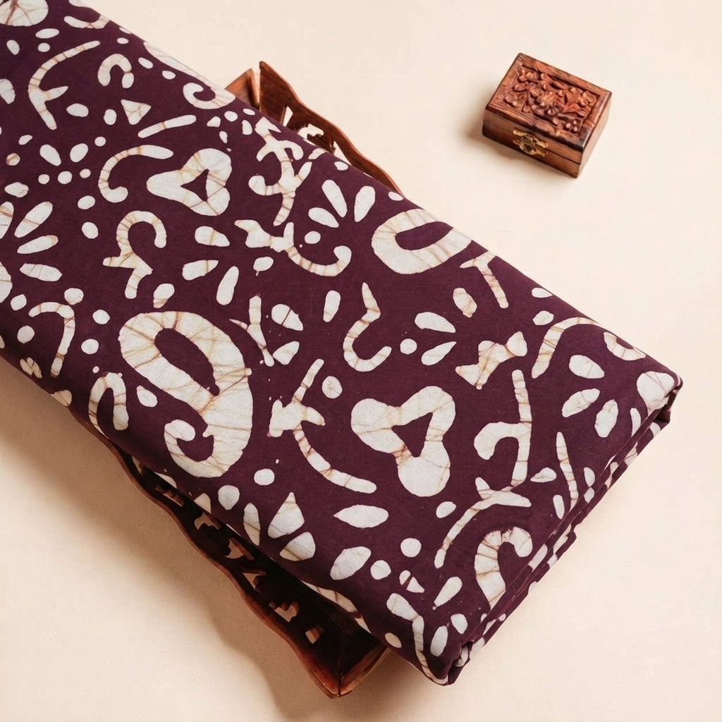 Folded Wine Batik Cotton Fabric Highlighting Paisley and Texture