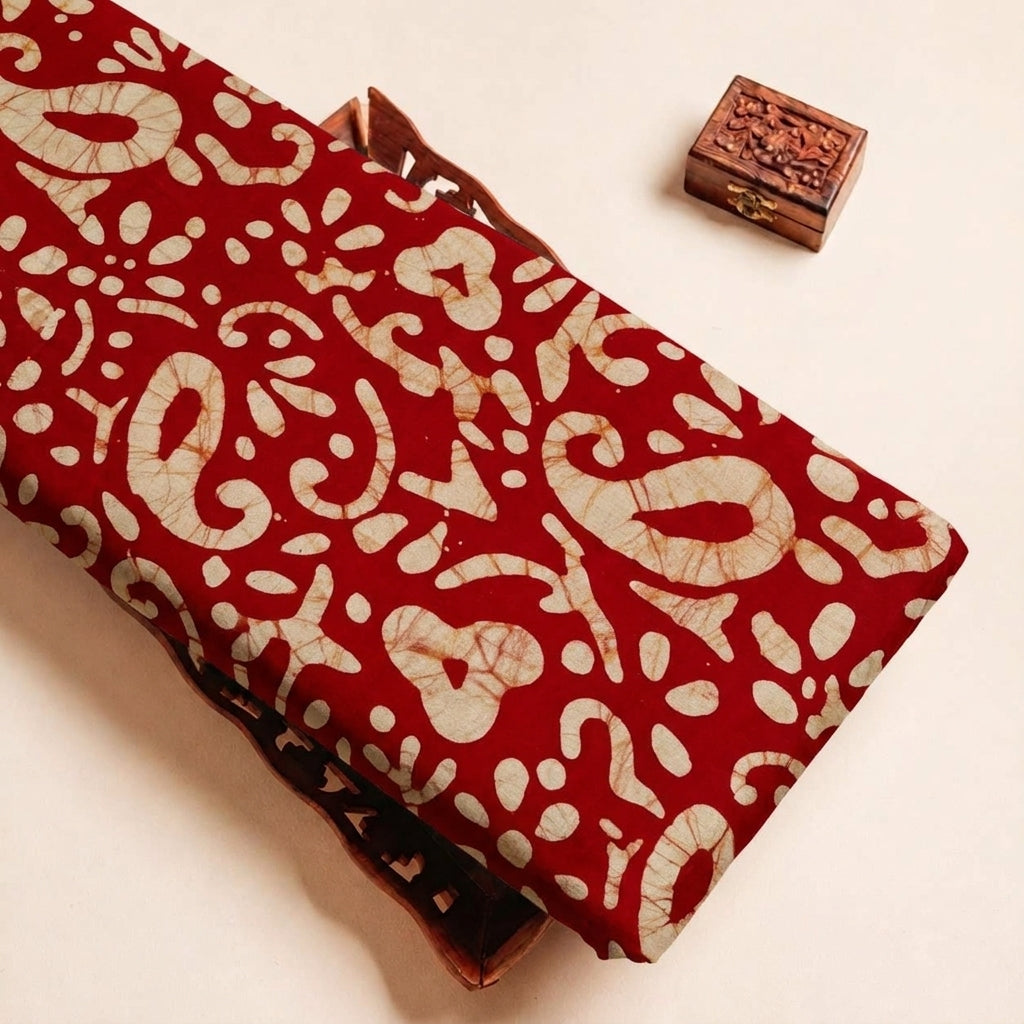 Folded Red Batik Cotton Fabric Highlighting Paisley and Texture