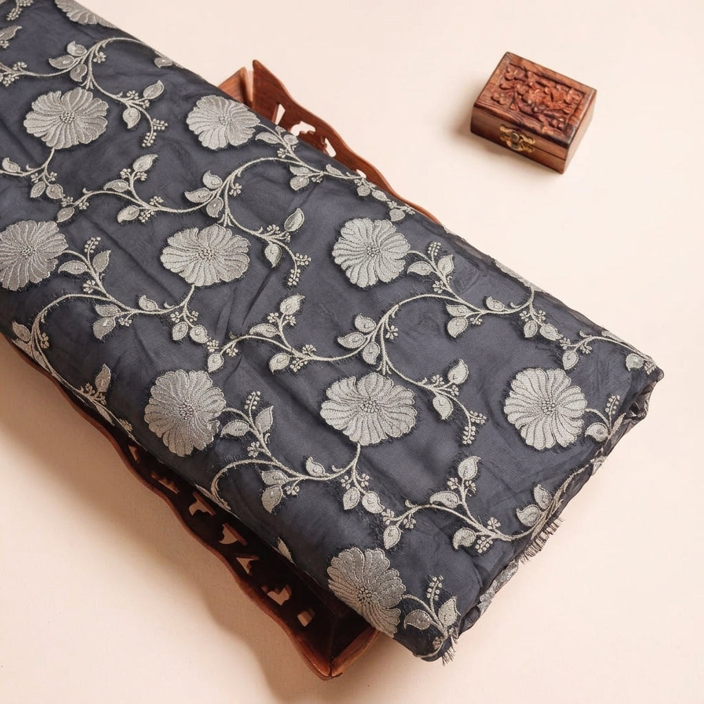 Embroidery Black Embroidery Semi Banaras Fabric on a wooden tray