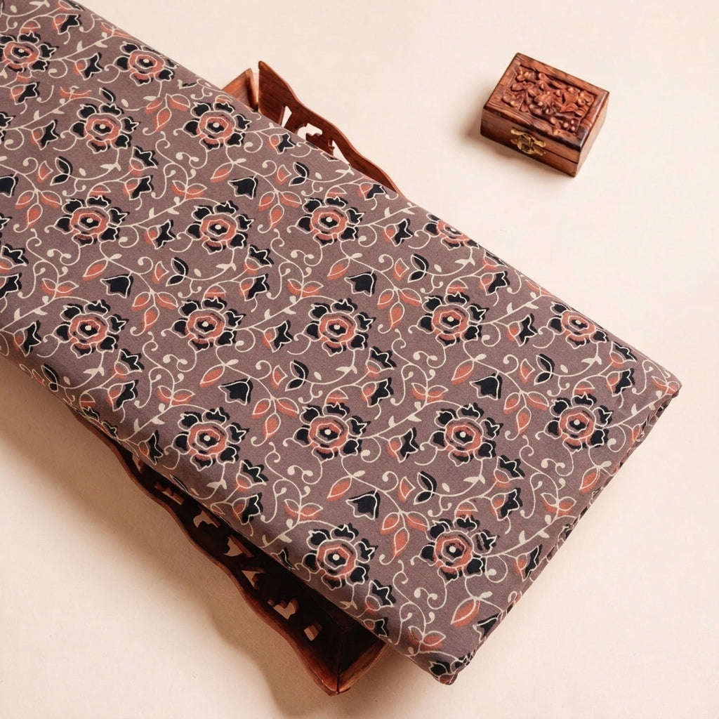 Folded Brown Ajrakh Cotton Fabric Highlighting Floral and Texture