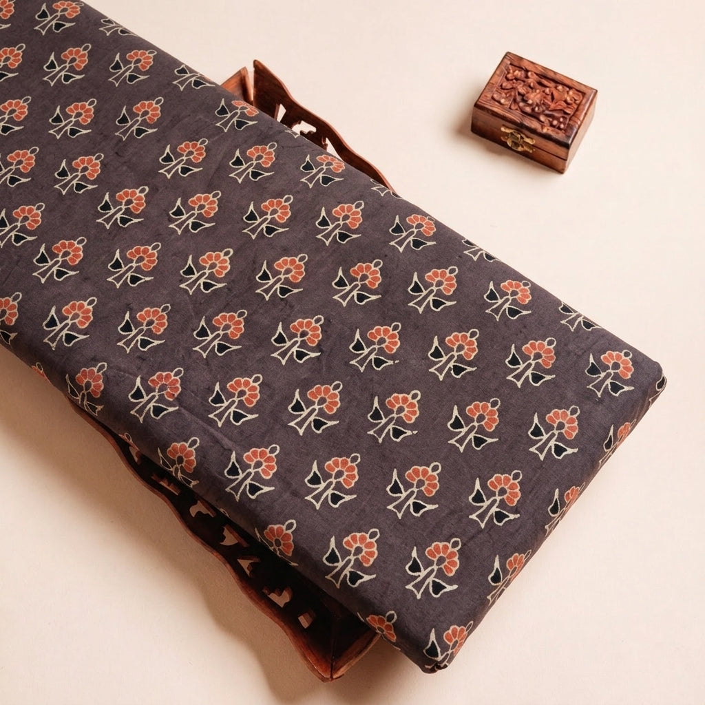 Folded Brown Ajrakh Cotton Fabric Highlighting Floral and Texture