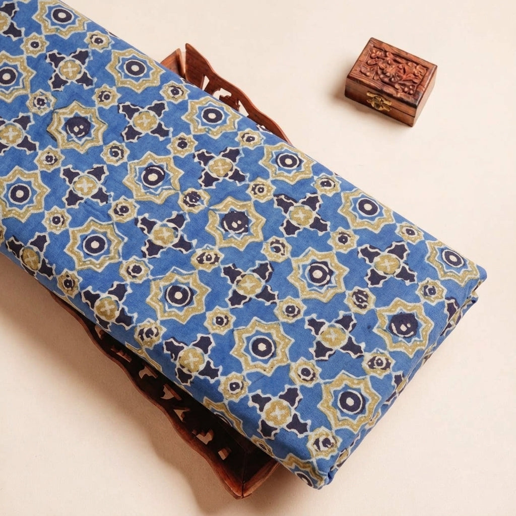 Folded Blue Ajrakh Modal Silk Fabric Highlighting Silk Block Print and Texture