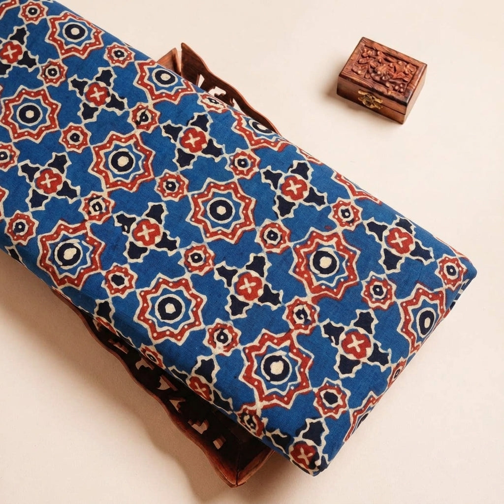Folded Blue Ajrakh Modal Silk Fabric Highlighting Silk Block Print and Texture