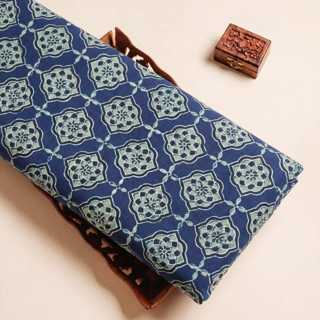 Folded Blue Ajrakh Modal Silk Fabric Highlighting Silk Block Print and Texture