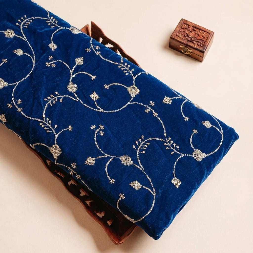 Folded Blue Embroidery Velvet Fabric Highlighting Thread Work Floral and Texture