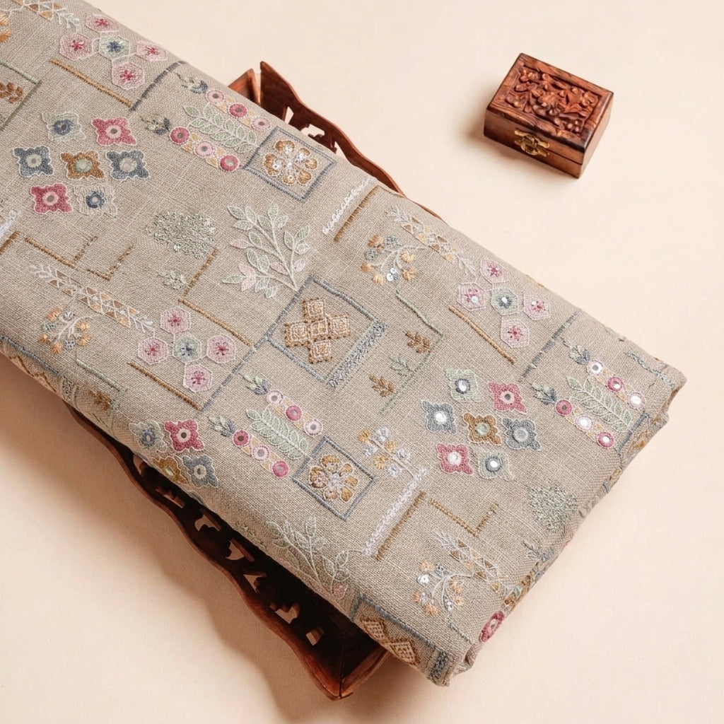 Folded Brown Embroidery Linen Fabric Highlighting Mirror Work Floral Thread Work and Texture