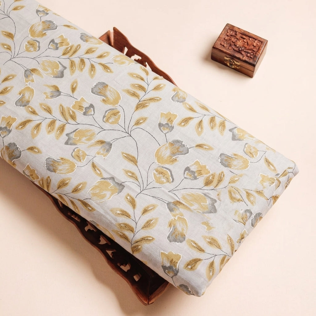 FLORAL YELLOW FLORAL MUL COTTON Fabric on a wooden tray