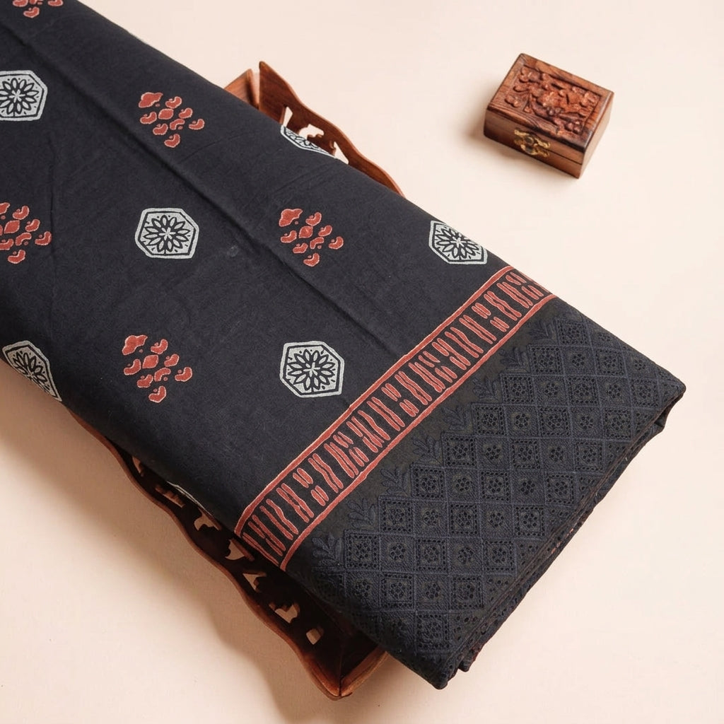 Cutwork Black Cutwork Cotton Fabric on a wooden tray