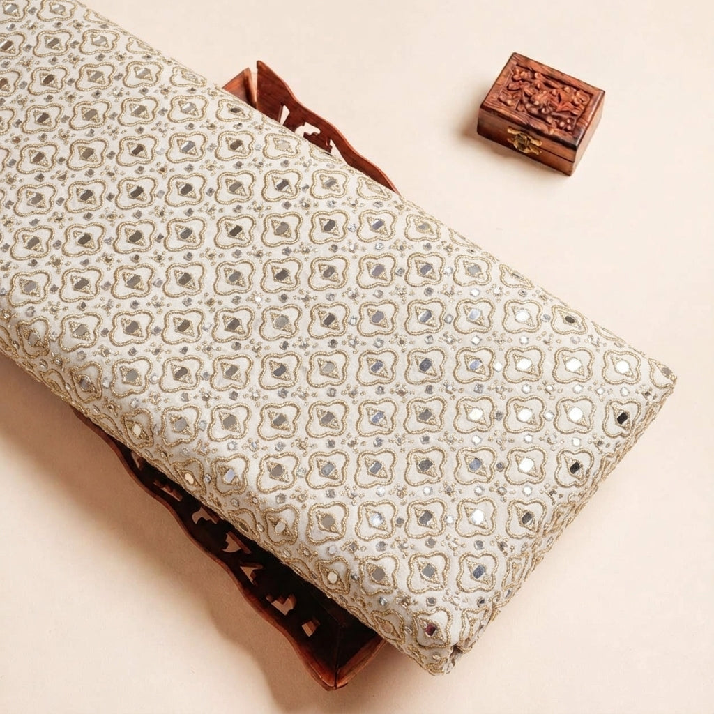 Folded White Embroidery Georgette Fabric Highlighting Mirror work Thread Work and Texture
