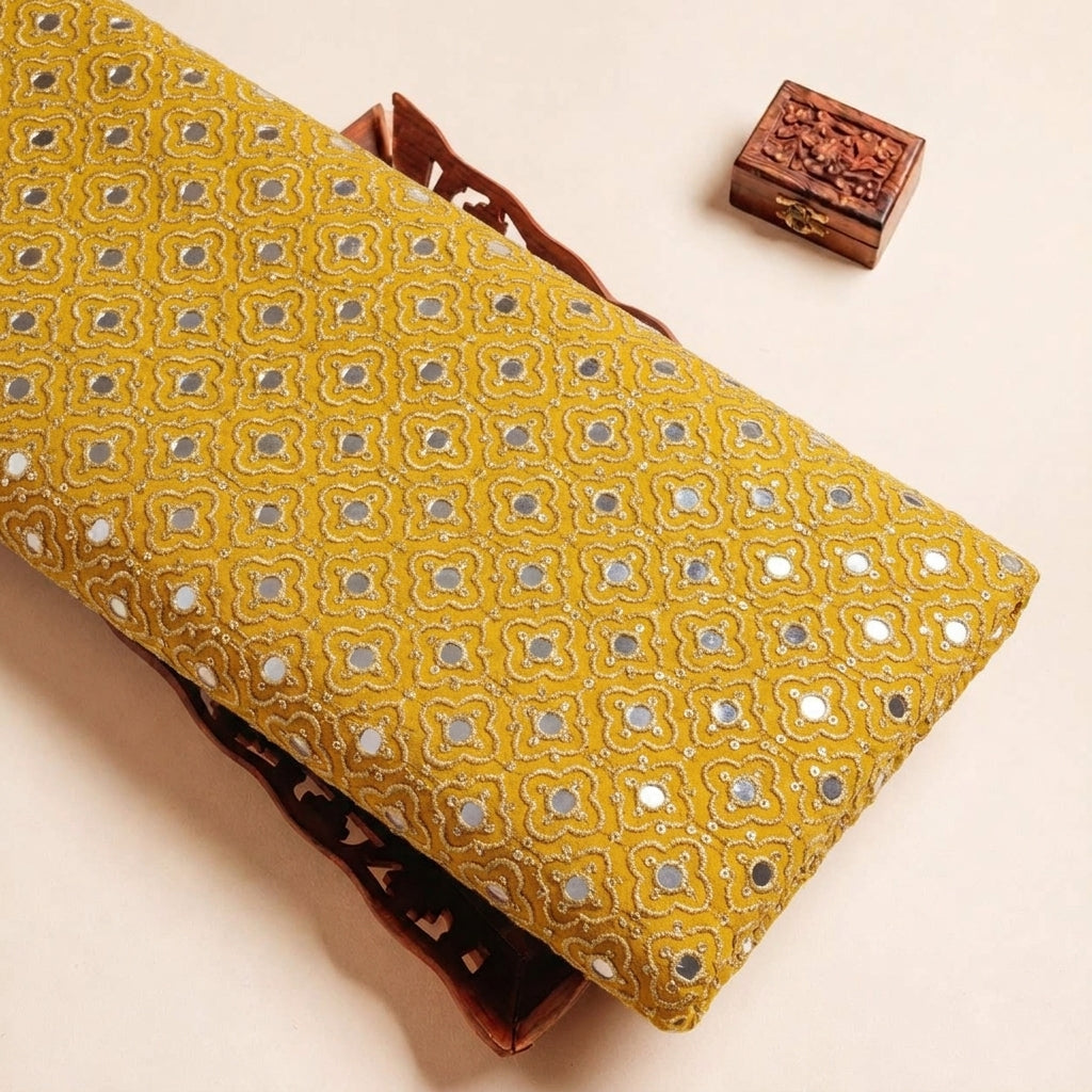 Folded Yellow Embroidery Georgette Fabric Highlighting Mirror work Thread Work and Texture