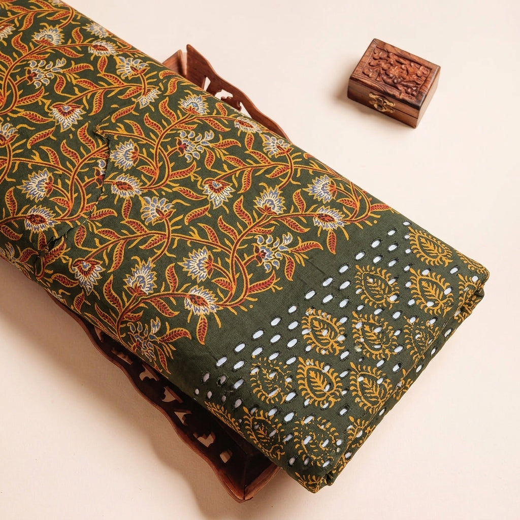 Cutwork Green Cutwork Cotton Fabric on a wooden tray